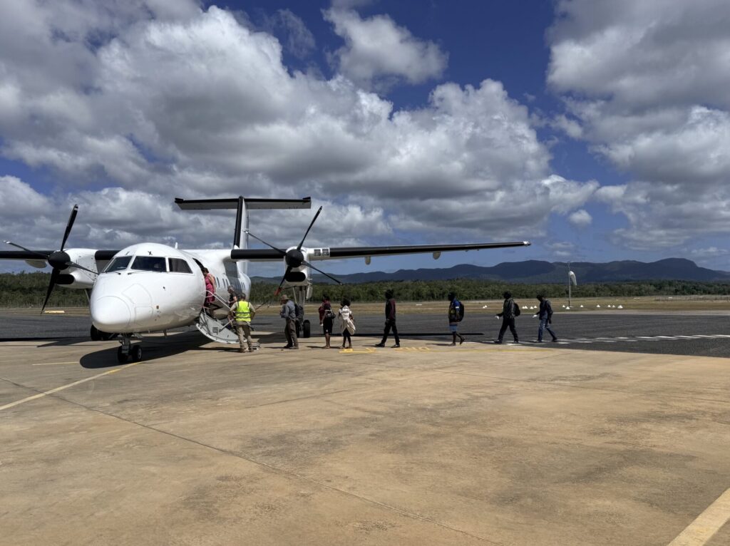 Passengers boarding in the plane at Lockart River's airport